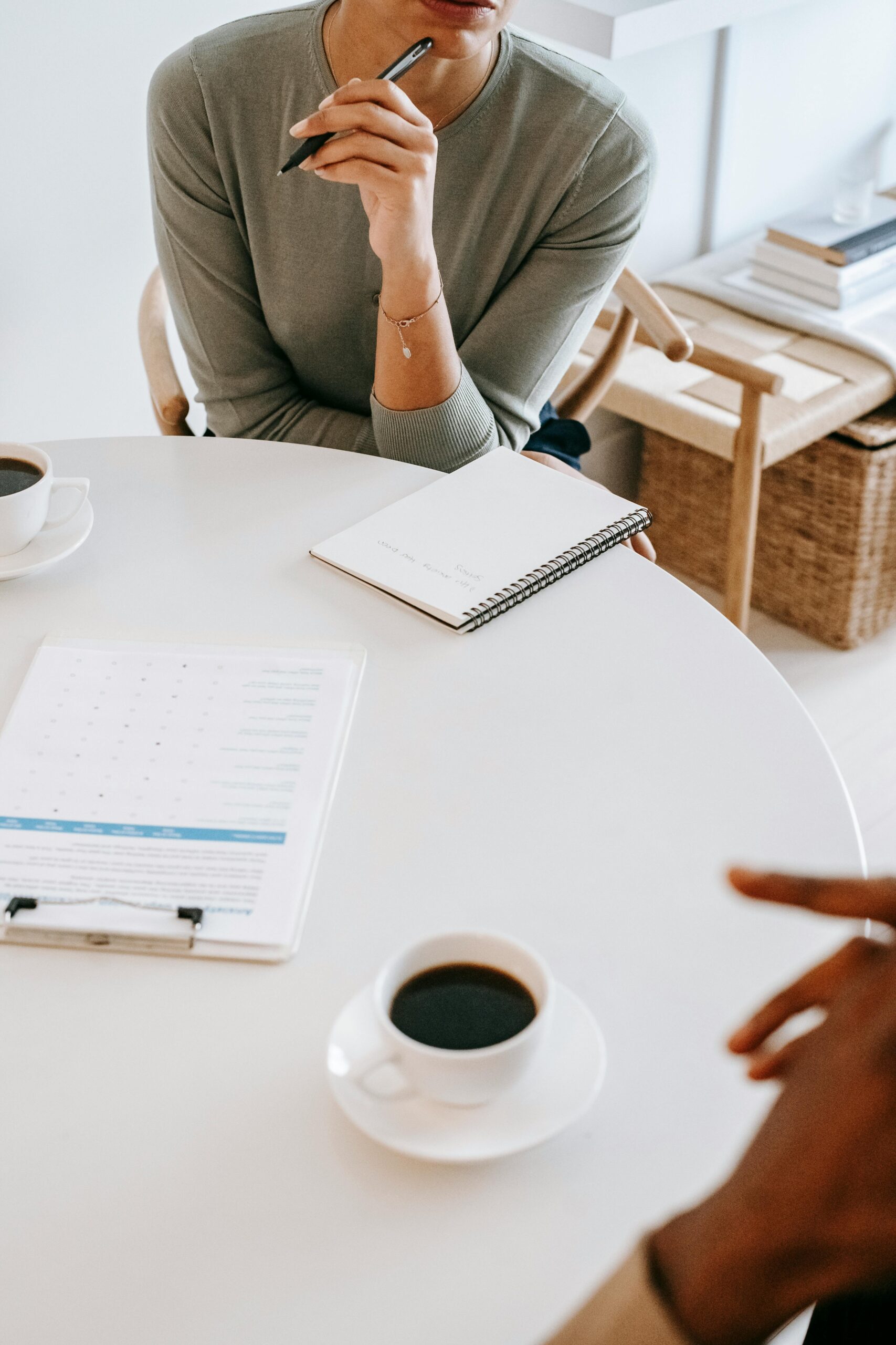 Psychologist consulting a patient in a modern office, emphasizing confidentiality and care.